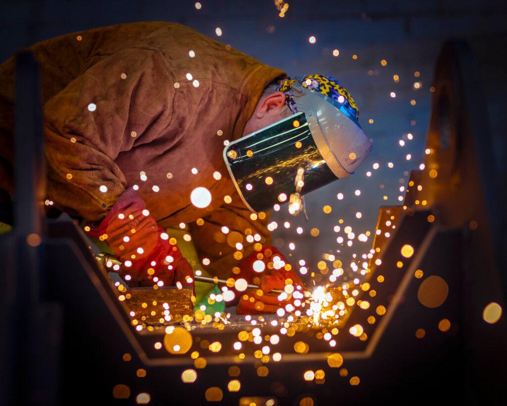 Welding and Fabrication Photograph showing a welder working on a steel fabrication