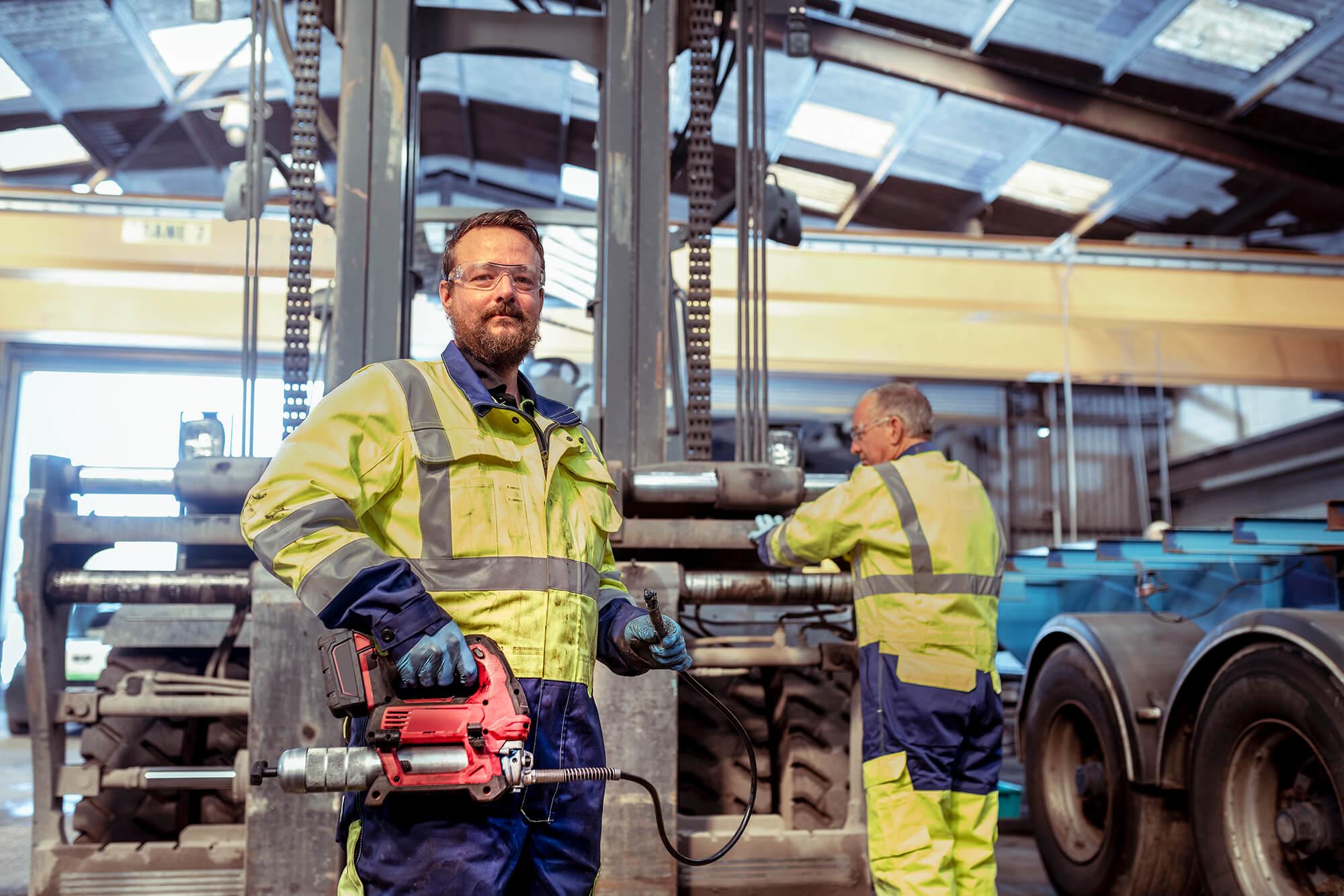 Hickman Engineering team working on a forklift