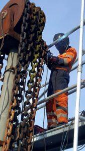 Engineer form Hickman Engineering working on a crane lift chain