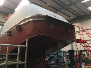 Rear underside view of a ABP Progress boat in for repair and re-painting with Hickman Engineering