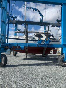 Swan Song boat on a marine crane / rig ready for repair
