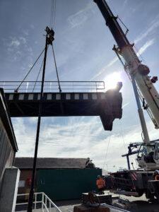 A crane used to lift a road access bridge away to be repaired - Hickman Engineering