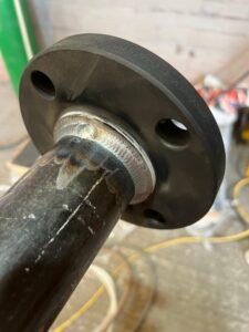 Close up of expert pipe welding for a high pressure system